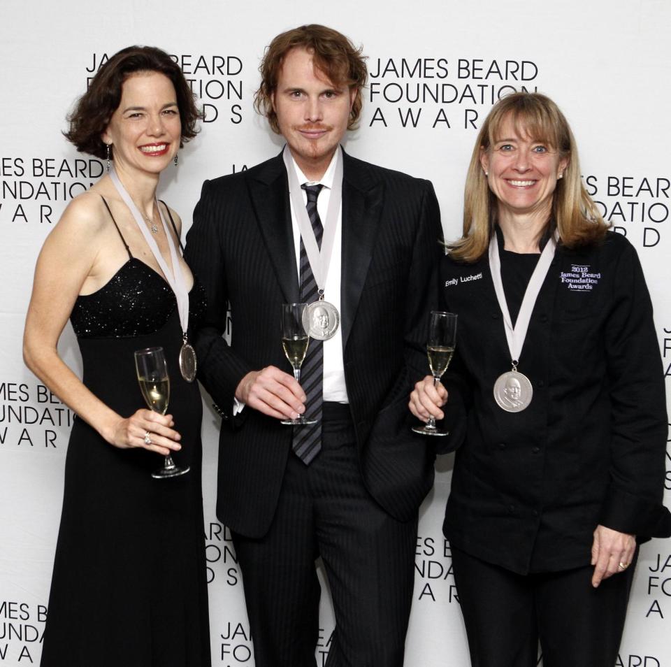 From left, journalist Dana Cowan, chef Grant Achatz and chef Emily Luchetti pose together after their Who's Who of Food & Beverage in America induction during the James Beard Foundation Awards, Monday, May 7, 2012, in New York. (AP Photo/Jason DeCrow)