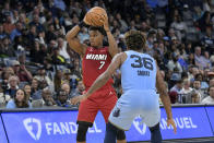 Miami Heat guard Kyle Lowry (7) handles the ball against Memphis Grizzlies guard Marcus Smart (36) in the first half of an NBA basketball game, Wednesday, Nov. 8, 2023, in Memphis, Tenn. (AP Photo/Brandon Dill)