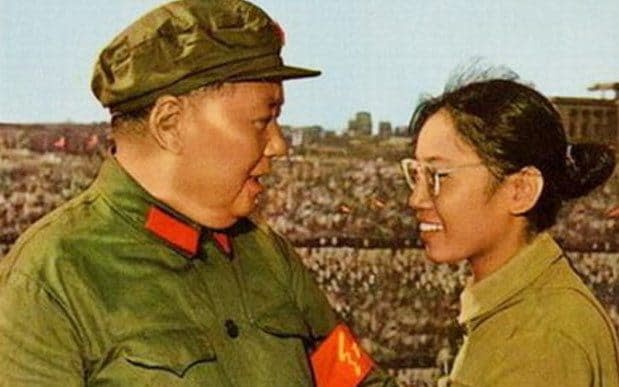 Song tying a red armband for Chairman Mao Zedong in 1966