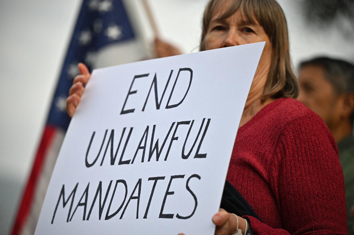 Workers at NASA's Jet Propulsion Laboratory (JPL) and their supporters protest November 1, 2021 outside JPL in Pasadena, California against a US government mandate requiring all federal employees to received the Covid-19 coronavirus vaccine. - Eleven US states with Republican governors sued the Biden administration on October 29, 2021 seeking to block a Covid-19 vaccine mandate for federal contractors, arguing it is unconstitutional and violates federal procurement law. (Photo by Robyn Beck / AFP) (Photo by ROBYN BECK/AFP via Getty Images)