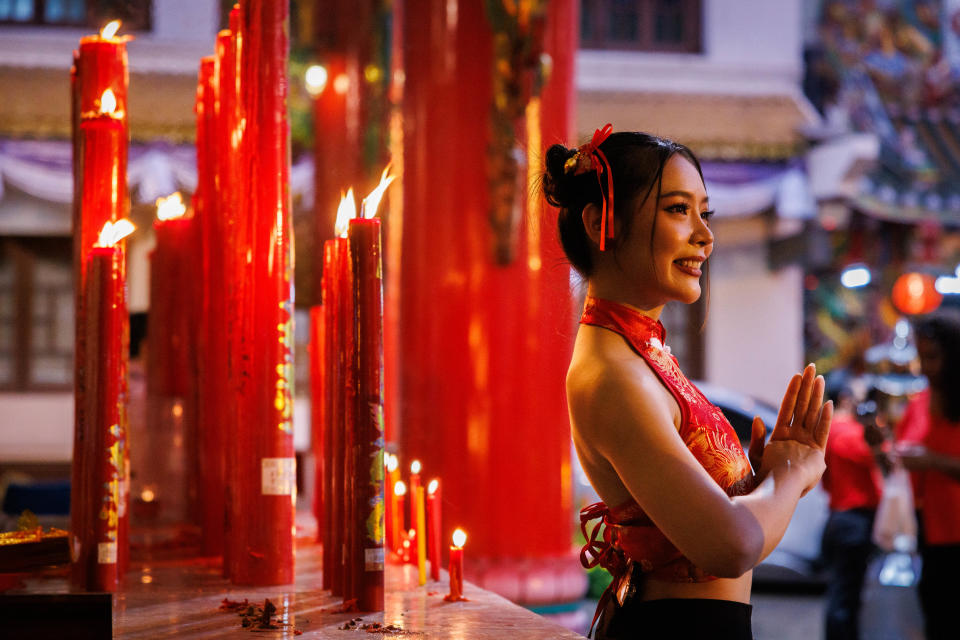 People light candles at Kuan Yim Shrine in Chinatown on Lunar New Year's Eve on February 09, 2024 in Bangkok, Thailand.