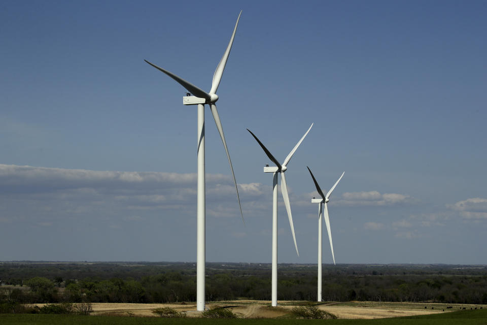 Completed wind turbines stand on a hilltop at the Reading Wind Facility in Reading, Kan., on Monday, April 27, 2020. Although the wind power project has experienced some delays in delivery of some foreign-sourced parts and had to implement social distancing measures, the project is on schedule to be completed in the next few weeks. (AP Photo/Charlie Riedel)