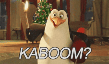cartoon penguin saying, kaboom while holding an explosive