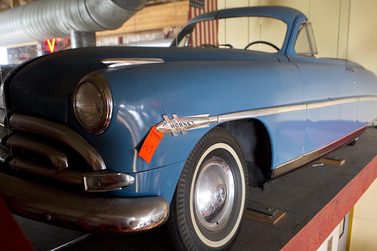 The front half of a vintage Hudson Motorcar is displayed on the wall overlooking diners at Hudson's Classic Grill in Marshfield. The creative use of mirrors made it look like a full car. Other authentic Hudson automotive memorabilia and 50s- and 60s-themed décor was also displayed throughout the restaurant.