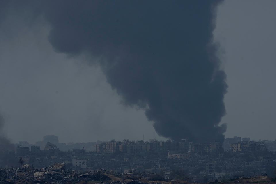 Smoke rises following an Israeli bombardment in the Gaza Strip, as seen from southern Israel, Friday, Dec. 8, 2023.