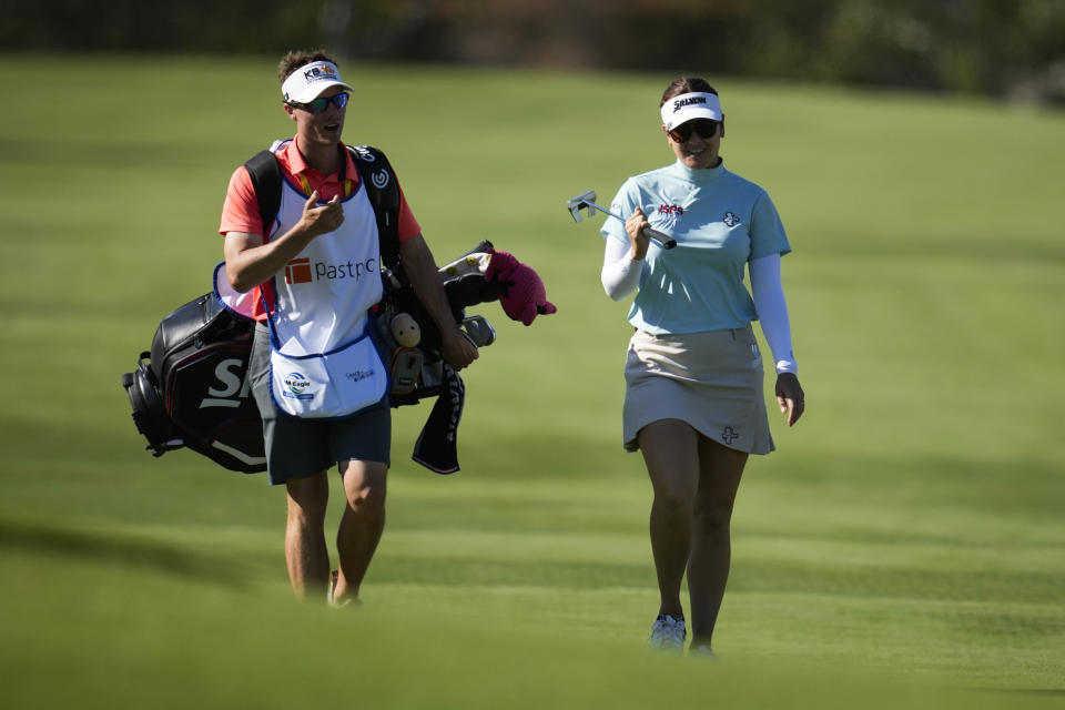 Hannah Green, right, walks down the 13th fairway during the third round of the LPGA's JM Eagle LA Championship golf tournament at Wilshire Country Club, Saturday, April 27, 2024, in Los Angeles. (AP Photo/Ashley Landis)