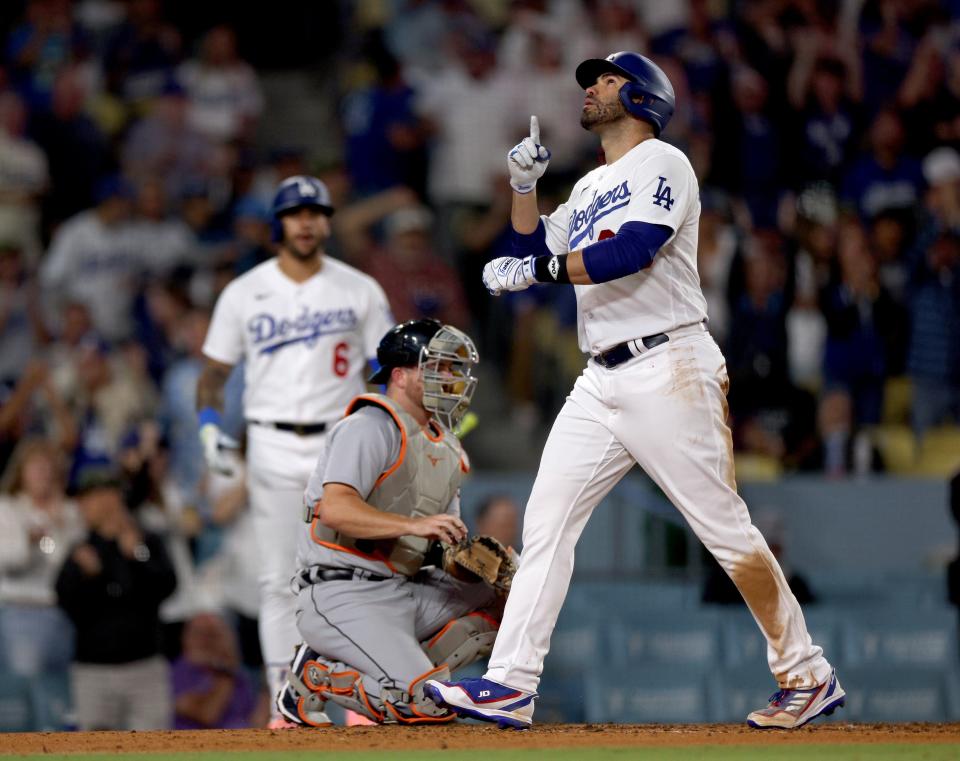 Dodgers designated hitter J.D. Martinez celebrates his solo home run in front of Tigers catcher Jake Rogers during the fourth inning on Tuesday, Sept. 19, 2023, in Los Angeles.