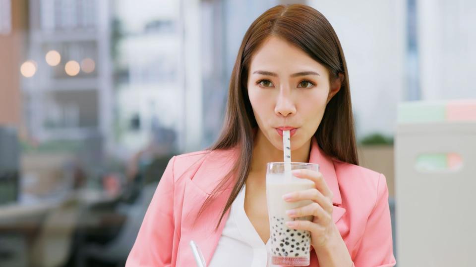 Woman drinking bubble tea.