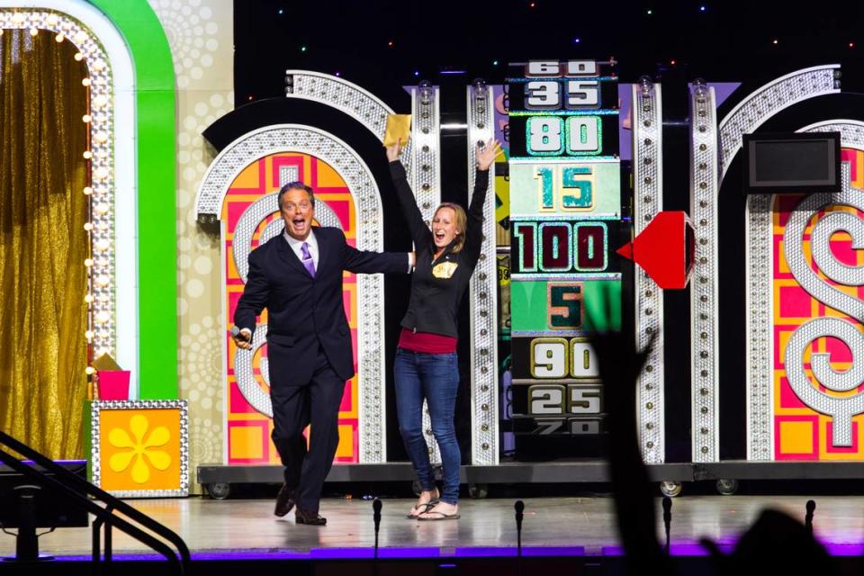 Todd Newton with a contestant during the “Price is Right” traveling show