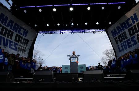 Emma Gonzalez, a student and shooting survivor from the Marjory Stoneman Douglas High School in Parkland, Florida, addresses the conclusion of the "March for Our Lives" event demanding gun control after recent school shootings at a rally in Washington, U.S., March 24, 2018. REUTERS/Jonathan Ernst