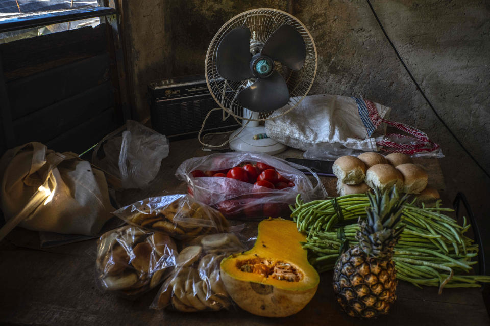 Rosa Lopez´s groceries, which she bought at the market, lay on a table at her home, amid a gas shortage in Mariel, Cuba, Thursday, May 18, 2023. It has been more than a month since any cooking gas has been delivered to Mariel, so she cooks over a wood-burning oven and the overall lack of gasoline for transportation has made the price of food rise. (AP Photo/Ramon Espinosa)