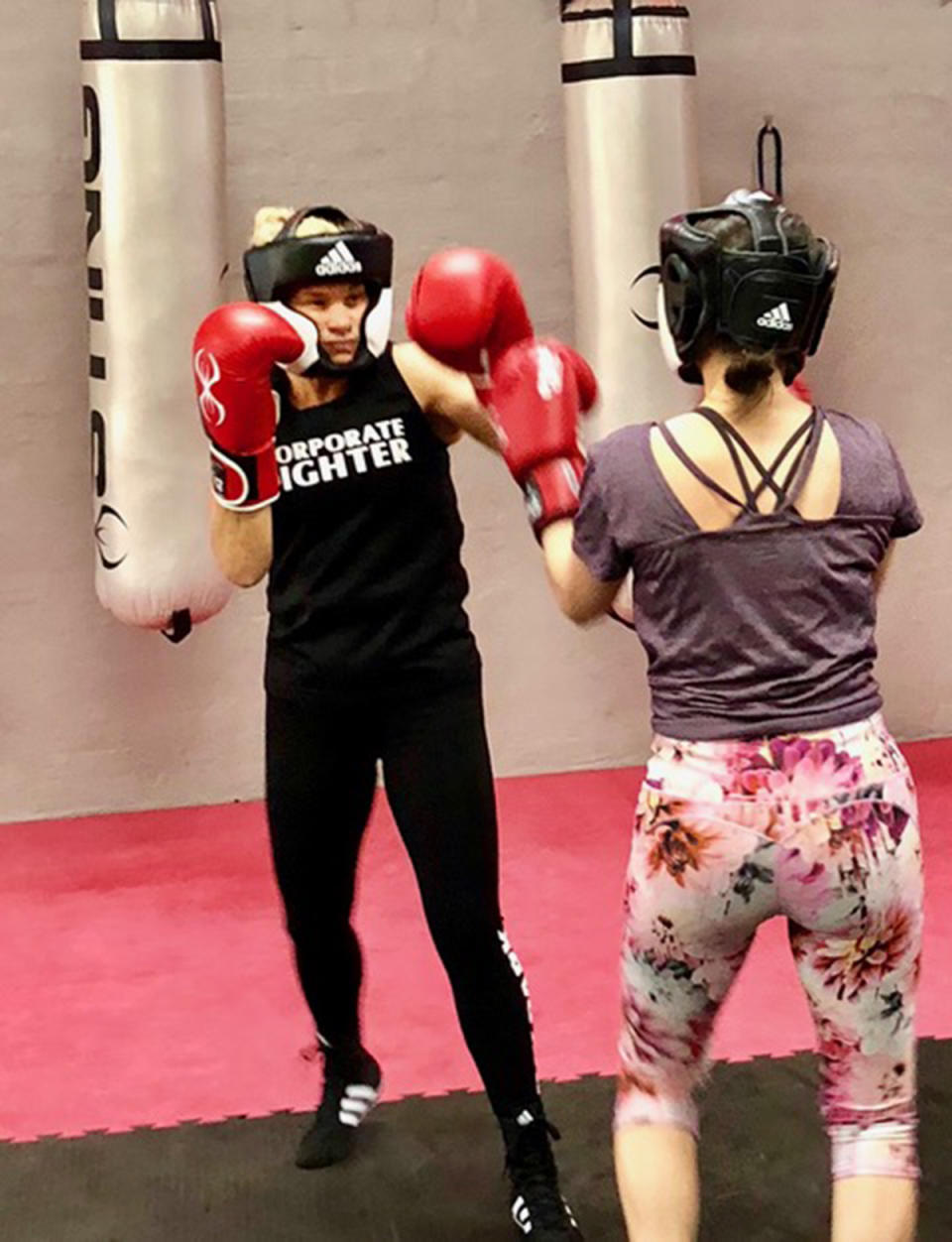 A photo of Sydney woman Maria boxing with another woman in a gym
