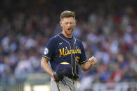 Milwaukee Brewers starting pitcher Eric Lauer (52) pauses with an eye problem against the Atlanta Bravesduring the third inning of Game 4 of a baseball National League Division Series, Tuesday, Oct. 12, 2021, in Atlanta. (AP Photo/Brynn Anderson)