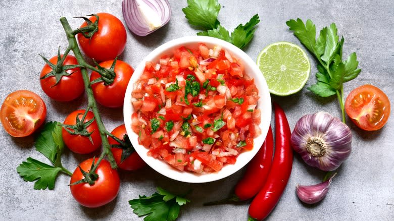 Salsa in bowl with ingredients