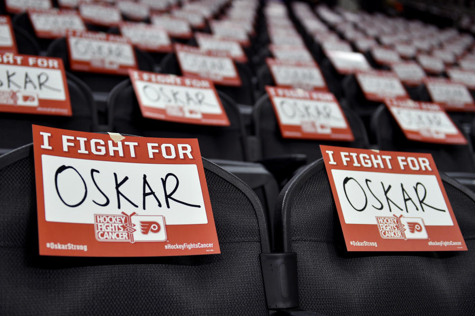 Signs are displayed in support for Philadelphia Flyers' Oskar Lindblom prior to an NHL hockey game against the Anaheim Ducks, Tuesday, Dec. 17, 2019, in Philadelphia. Lindblom is missing the rest of the season after being diagnosed with Ewing's sarcoma, a cancerous tumor that grows in the bones or in the tissue around bones. (AP Photo/Derik Hamilton)