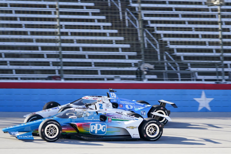 Graham Rahal (15) attempts to pass Josef Newgarden (2) during the final practice round of an IndyCar Series auto race at Texas Motor Speedway in Fort Worth, Texas, Saturday, March 19, 2022. (AP Photo/Randy Holt)