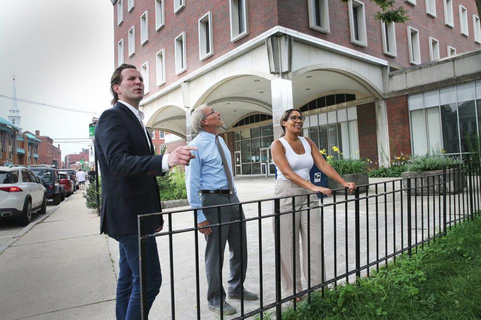 Portsmouth City Council recently voted to try to get the federal building for free and are hoping to reach a consensus on what to do with the building. Mayor Deglan McEachern, left, and councilors John Tabor and  Jo Kelley andare at the site.