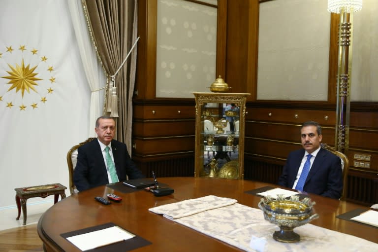 Turkish President Recep Tayyip Erdogan (L) meets with Intelligence Chief Hakan Fidan (R) in Ankara, on July 22, 2016