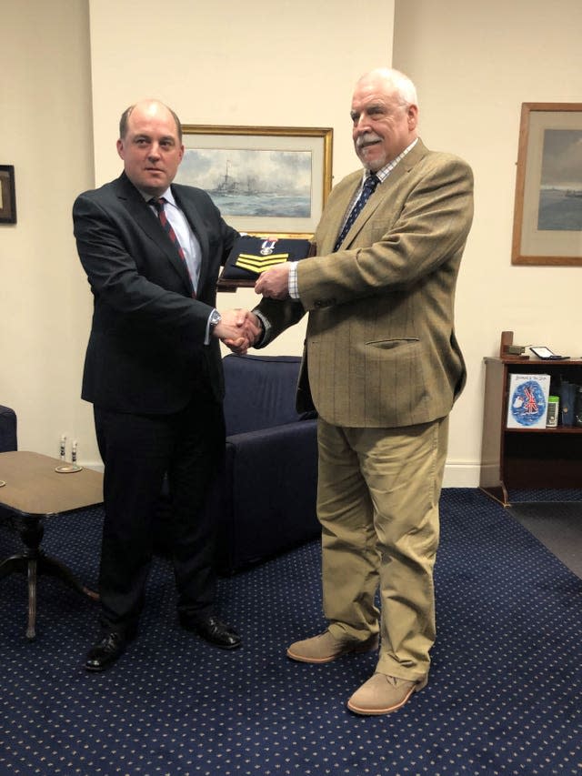 Joe Ousalice receives his medal from Defence Secretary Ben Wallace