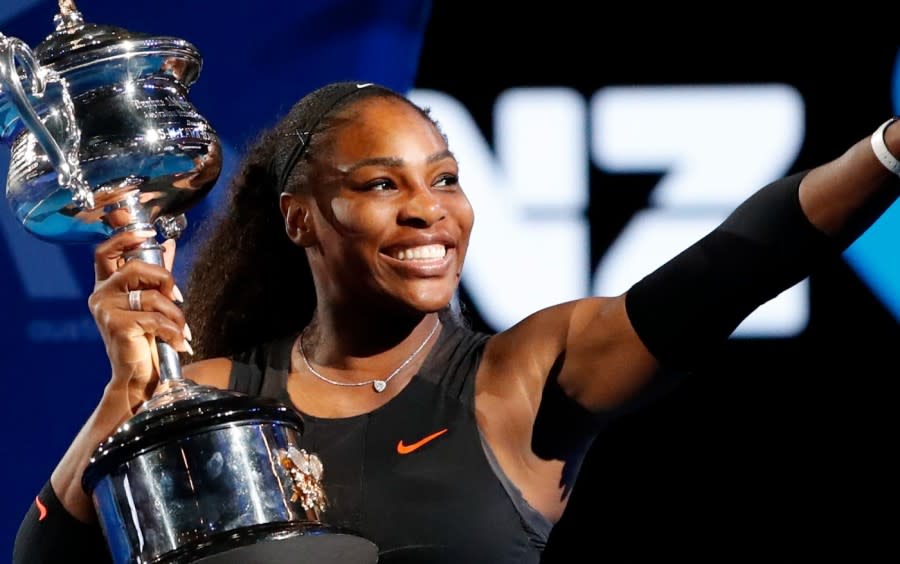 <em>In this Saturday, Jan. 28, 2017, file photo, United States’ Serena Williams holds her trophy after defeating her sister Venus during the women’s singles final at the Australian Open tennis championships in Melbourne, Australia. Unbeknownst to fans and foes, Serena Williams was two months pregnant when she won the 2017 Australian Open. (AP Photo/Dita Alangkara, File)</em>