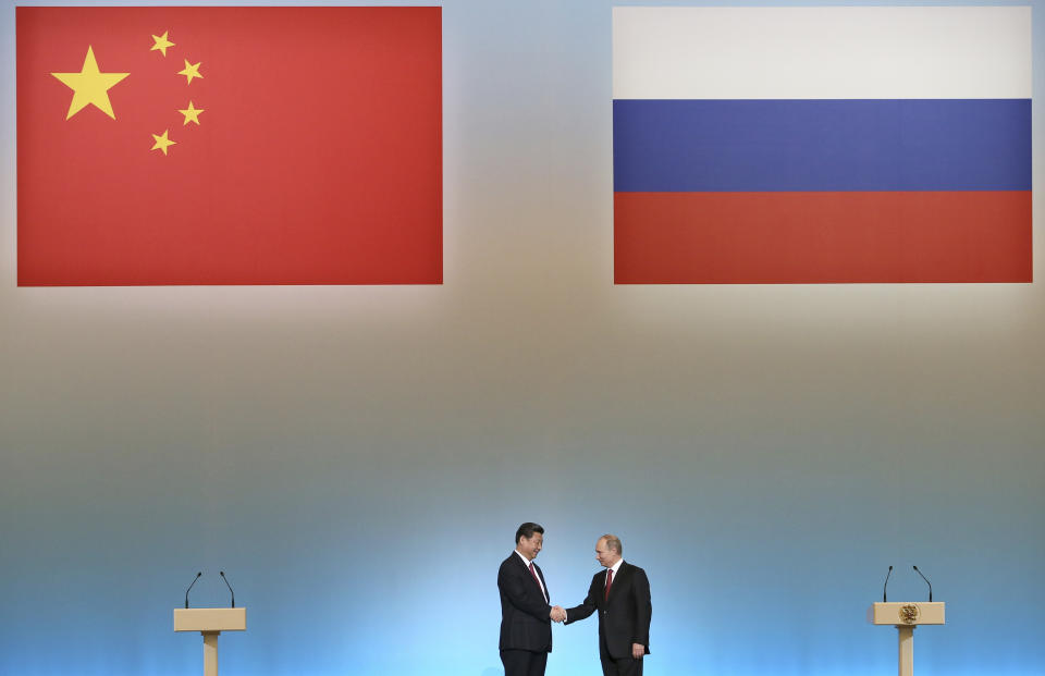 FILE - Russian President Vladimir Putin, right, and Chinese President Xi Jinping shake hands at the opening ceremony of the Year of Chinese tourism in Russia, in the Kremlin in Moscow, Friday, March 22, 2013. China's muted reaction to the Wagner mercenary group uprising against Russia's military belies Beijing's growing anxieties over the war in Ukraine and how this affects the global balance of power. (AP Photo/Sergei Ilnitsky, Pool, File)