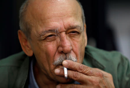 Yasser Abed Rabbo, former official of Palestinian Liberation Organization (PLO), smokes a cigarette during an interview with Reuters, in Ramallah, in the occupied West Bank September 9, 2018. REUTERS/Mohamad Torokman