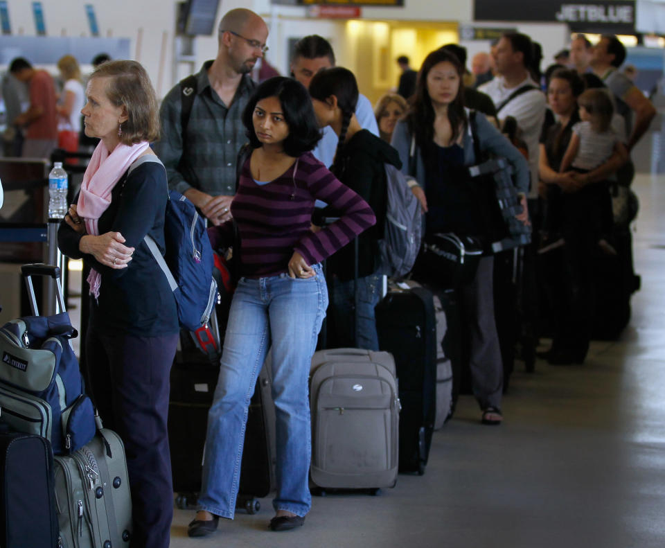 Airline travellers stand in line to get to the United airlines ticketing counter at Newark Airport in Newark, New Jersey on Aug. 29, 2011.&nbsp;