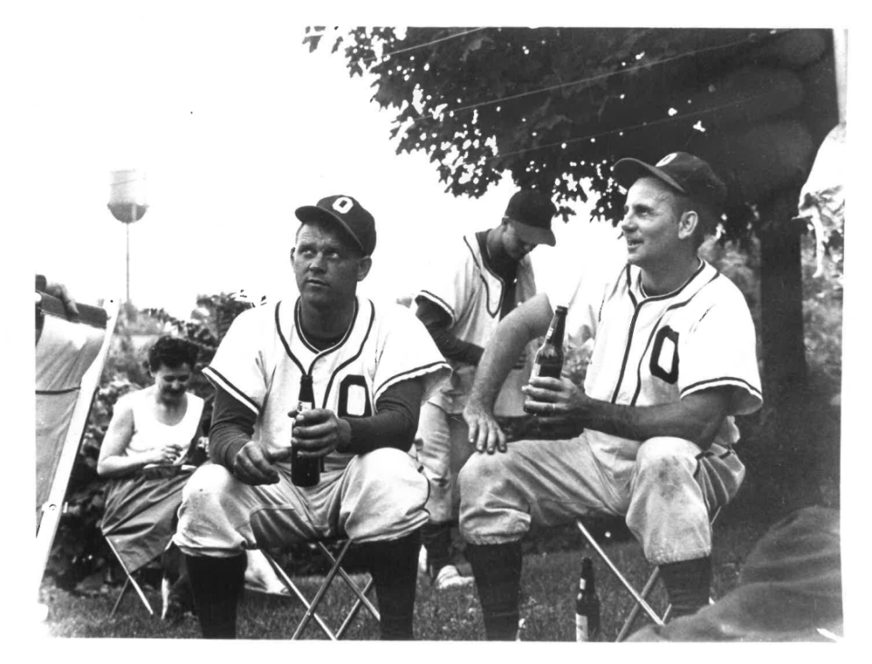 Charlie Koester, left, in the uniform of the Oldenburg Villagers of the Tri-County Baseball League