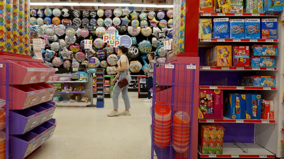 People shop in a Party City store on January 18, 2023 in Miami, Florida. - Joe Raedle/Getty Images