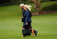 White House Chief of Staff John Kelly talks with Kirstjen Nielsen, President Donald Trump's nominee to lead the U.S. Department of Homeland Security, as they depart the White House in Washington, U.S., October 13, 2017. REUTERS/Kevin Lamarque