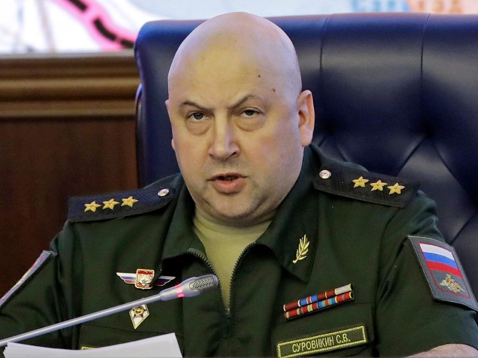 Colonel General Sergei Surovikin, Commander of the Russian forces in Syria, speaks, with a map of Syria projected on the screen in the back, at a briefing in the Russian Defense Ministry in Moscow, Russia, Friday, June 9, 2017. Russia's Defense Ministry announced that air force chief, Gen. Sergei Surovikin, would be the commander of all Russian troops fighting in Ukraine. The statement marked the first official appointment of a single commander for the entire Russian force in Ukraine.