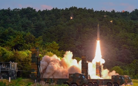 South Korean troops fire Hyunmoo Missile into the waters of the East Sea at a military exercise - Credit: Defense Ministry/Yonhap/via REUTERS