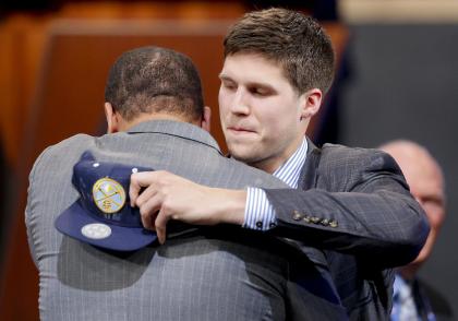 Doug McDermott is congratulated after being selected 11th overall. (AP)