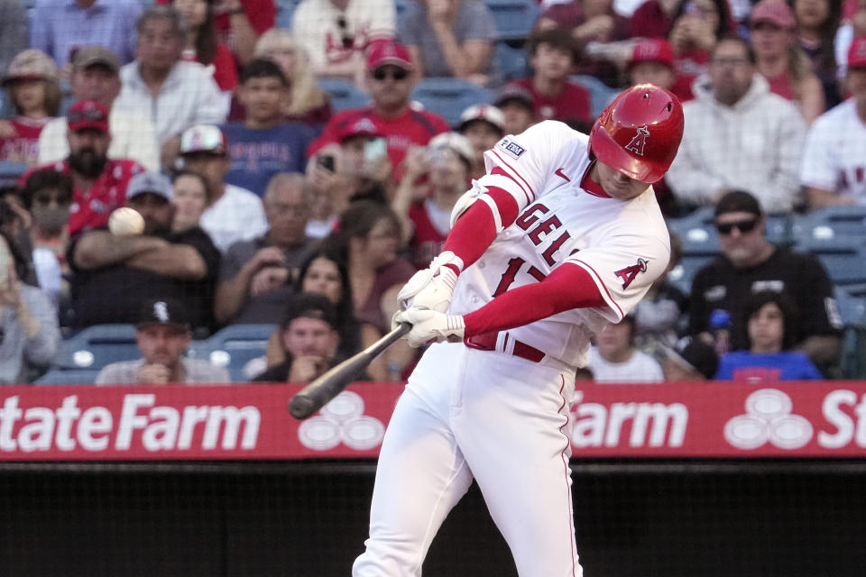 Los Angeles Angels' Shohei Ohtani hits a solo home run during the first inning of a baseball game against the Chicago White Sox Tuesday, June 27, 2023, in Anaheim, Calif. (AP Photo/Mark J. Terrill)