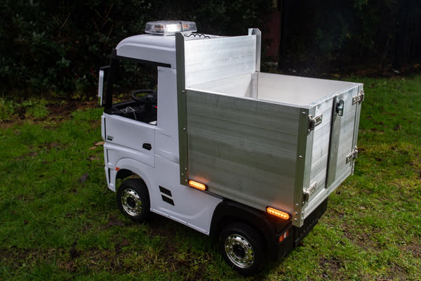 The 24-volt battery-powered four-wheel drive lorry has a plank aluminium body and flashing safety lights and is big enough for a child to sit in and drive. (SWNS)  