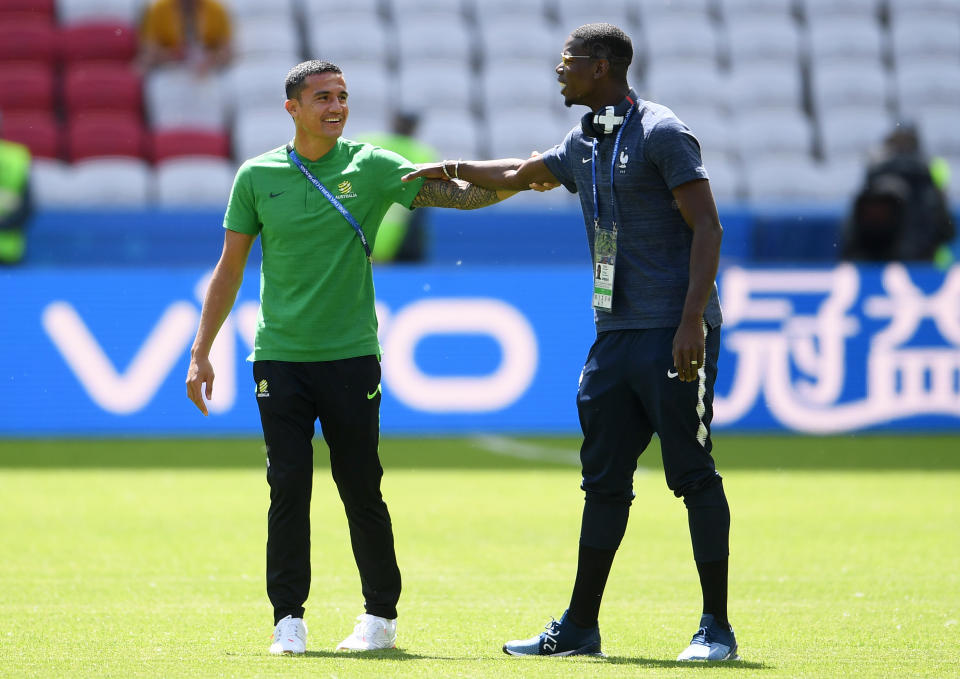 <p>Tim Cahill and Paul Pogba catch up ahead of the big Group C match </p>