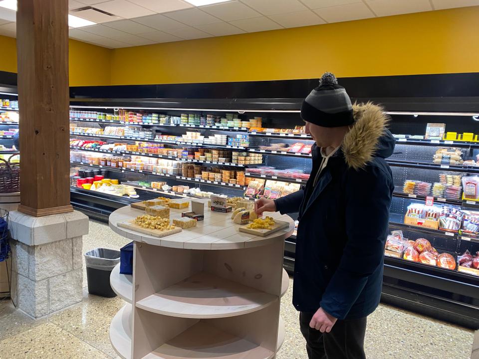 keith eating free samples at the mars cheese castle in wisconsin