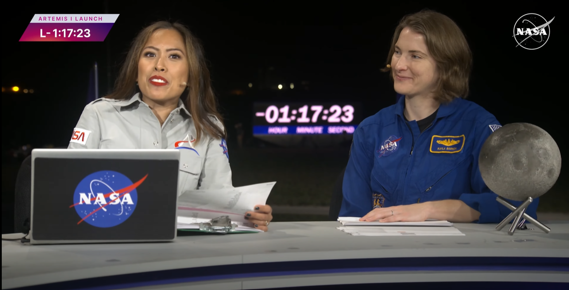 NASA astronaut Kayla Barron, right, co-anchors the Wednesday morning launch of Artemis I with NASA broadcaster Megan Cruz in Cape Canaveral, Fla. The Orion capsule that was successfully launched is expected to reach the moon Monday in the Artemis Program’s first unmanned trip to orbit the moon.