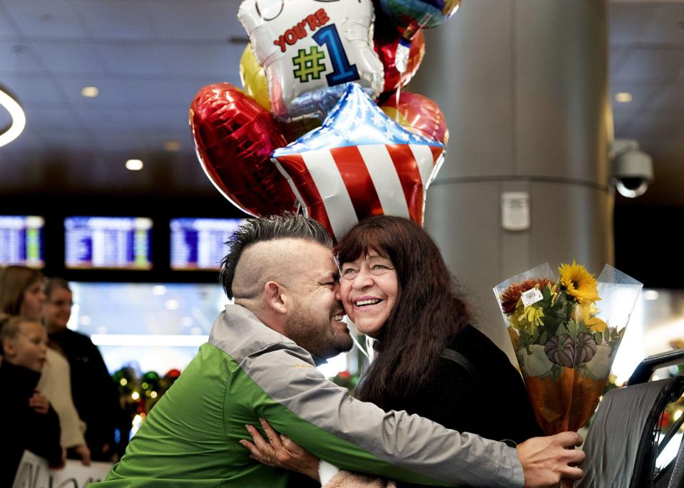Patricio Perez is reunited with his mother, Rosa Acuna, of Chilé, at the Salt Lake City International Airport on Tuesday, Nov. 21, 2023. The two had not seen one another in a year and a half. AAA estimates that 55.4 million travelers will head 50 miles or more from home over the Thanksgiving holiday period between Wednesday and Sunday, Nov. 26. | Laura Seitz, Deseret News