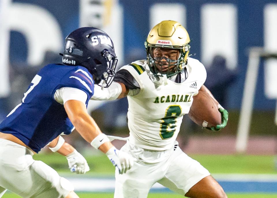 Russell Babineaux 8 runs the ball as Stm takes on Acadiana football. Friday, Sept. 20, 2024.