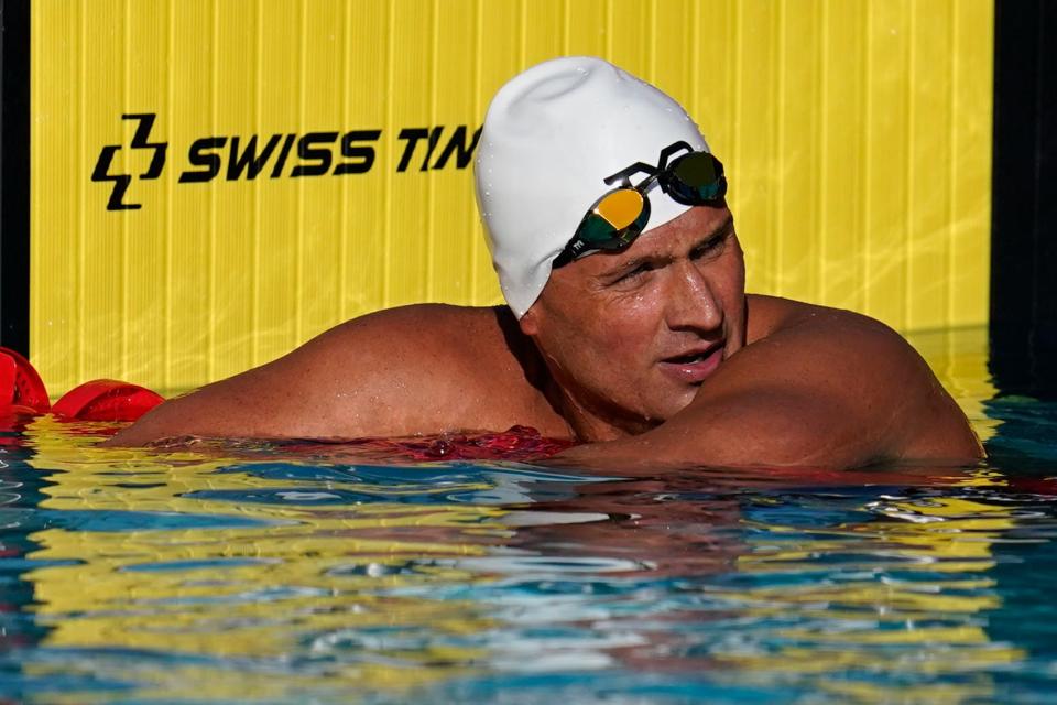 In this April 8, 2021, file photo, Ryan Lochte pauses after competing in the men's 200-meter freestyle preliminary race at the TYR Pro Swim Series swim meet in Mission Viejo, Calif.