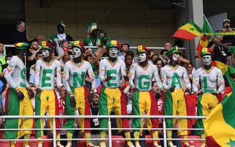 Senegal's supporters cheer their team during the Russia 2018 World Cup Group H football match between Poland and Senegal - Credit: AFP