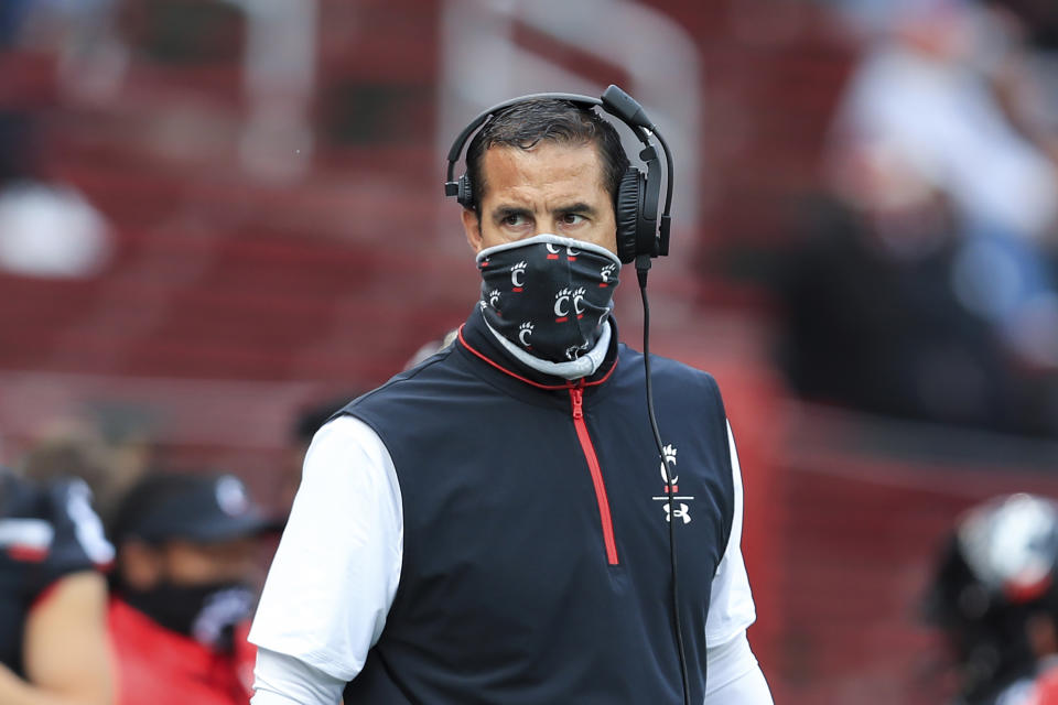Cincinnati head coach Luke Fickell works the sideline during an NCAA college football game against South Florida, Saturday, Oct. 3, 2020, in Cincinnati. No. 8 Cincinnati's game at Tulsa on Saturday has been postponed because of positive COVID-19 tests among Bearcats players. The American Athletic Conference announced Thursday, Oct. 15, the game is being rescheduled for Dec. 5. (AP Photo/Aaron Doster, File)