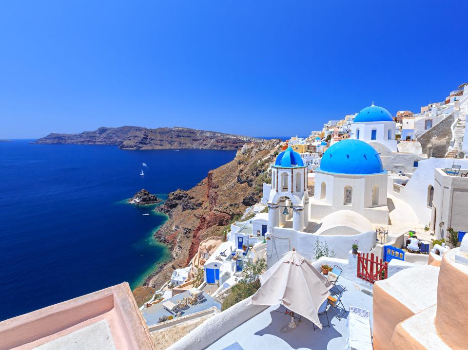 View of Santorini Greece with oceans and blue-and-white buildings