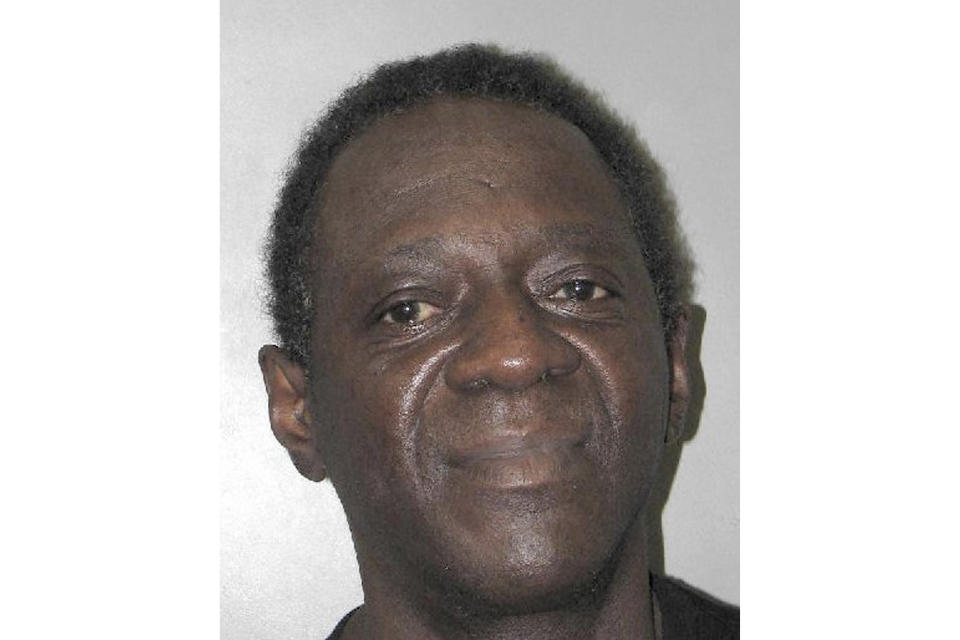 This Henderson Detention Center booking photo shows entertainer Flavor Flav following his arrest Oct. 4, 2021, in Henderson, Nev. Police and court documents said Tuesday, Oct. 19 the 62-year-old former hip-hop and reality TV star, whose legal name is William Jonathan Drayton Jr., faces a misdemeanor domestic battery charge stemming from a scuffle with his girlfriend at home. Drayton's lawyers say they'll explain his side of the story in court. (Henderson Police Department via AP)