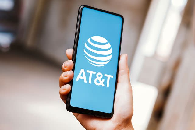 <p>Rafael Henrique/SOPA Images/LightRocket via Getty</p> AT&T logo on smartphone screen