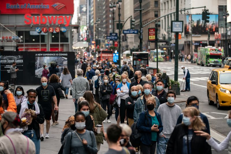 Voters line up to cast ballots on the first day of early voting in New York