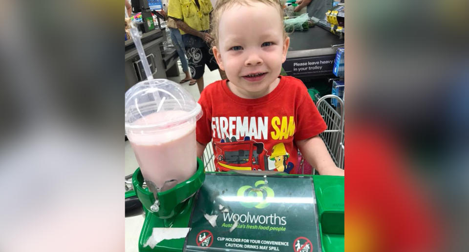 The boy pictured with his milkshake at Woolworths. Source: ‎Danielle Anne‎/ Facebook