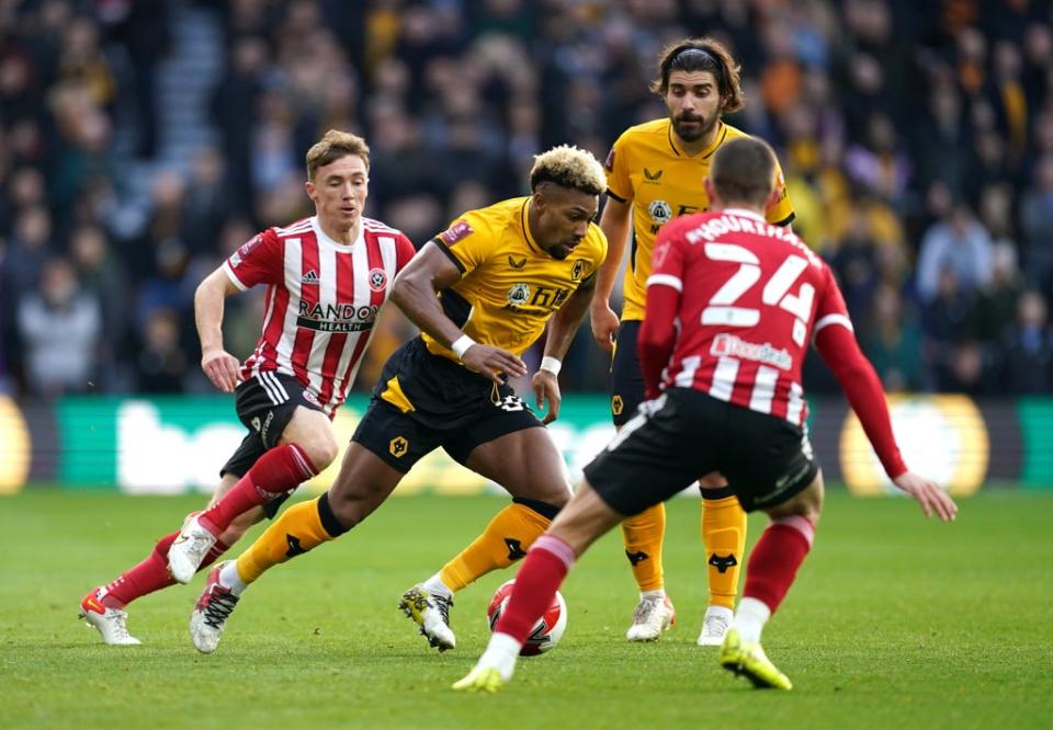 Adama Traore, centre, remains a target for Tottenham (Nick Potts/PA) (PA Wire)