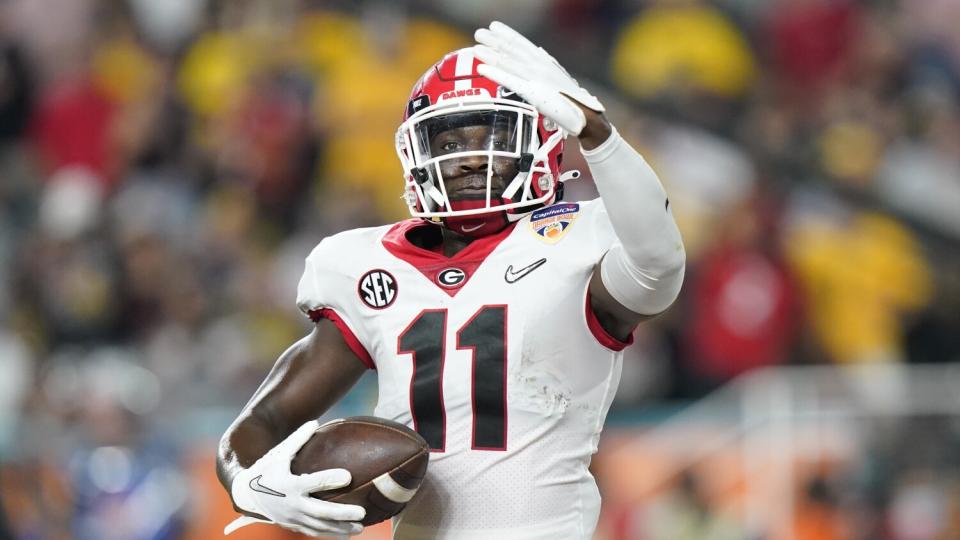 Georgia defensive back Derion Kendrick celebrates after intercepting a pass.